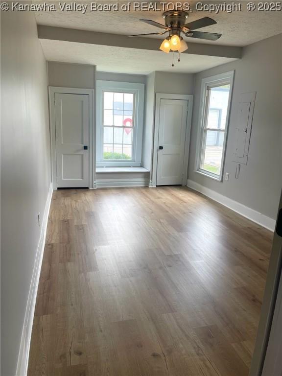 517 16th St, Dunbar, WV 25064 - unfurnished room with baseboards, wood finished floors, and ceiling fan
