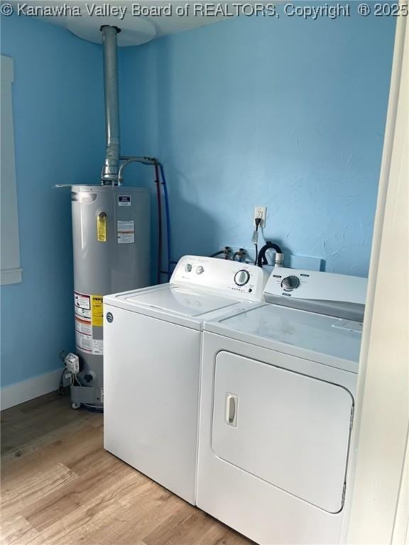 517 16th St, Dunbar, WV 25064 - washroom featuring gas water heater, washer and dryer, and light wood-style floors