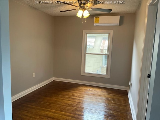 517 16th St, Dunbar, WV 25064 - unfurnished room featuring a wall unit AC, ceiling fan, a textured ceiling, wood finished floors, and baseboards