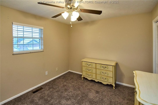 121 1st Ave, South Charleston, WV 25303 - bedroom with dark colored carpet, baseboards, a ceiling fan, and a textured ceiling