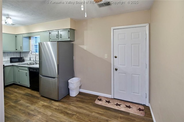 121 1st Ave, South Charleston, WV 25303 - kitchen featuring black appliances, dark wood finished floors, backsplash, a sink, and baseboards