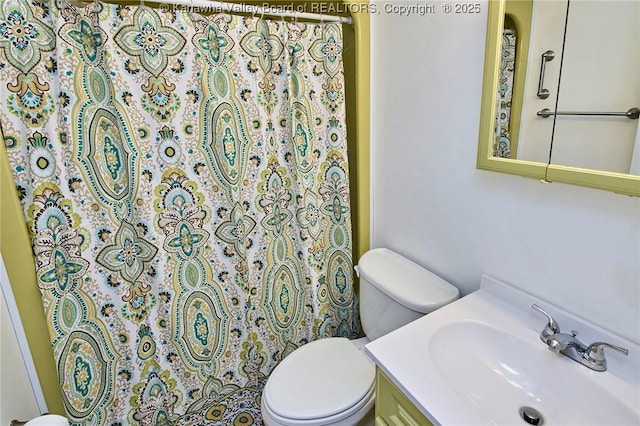 121 1st Ave, South Charleston, WV 25303 - bathroom with toilet, vanity, and a shower with shower curtain
