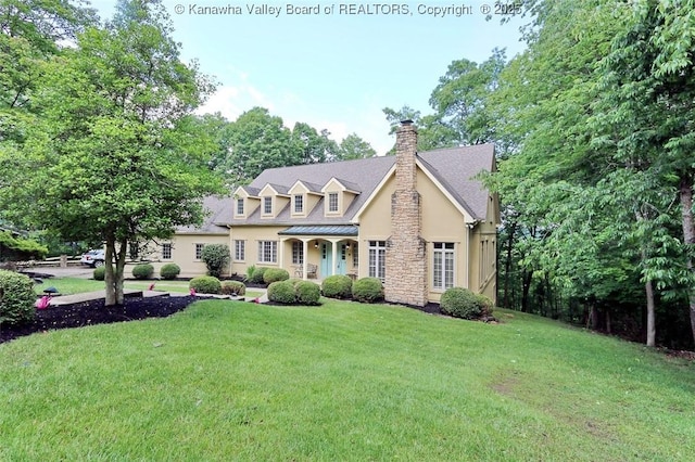 5 Stony Point Rd, Charleston, WV 25314 - cape cod house featuring stucco siding, a chimney, a front yard, stone siding, and a standing seam roof