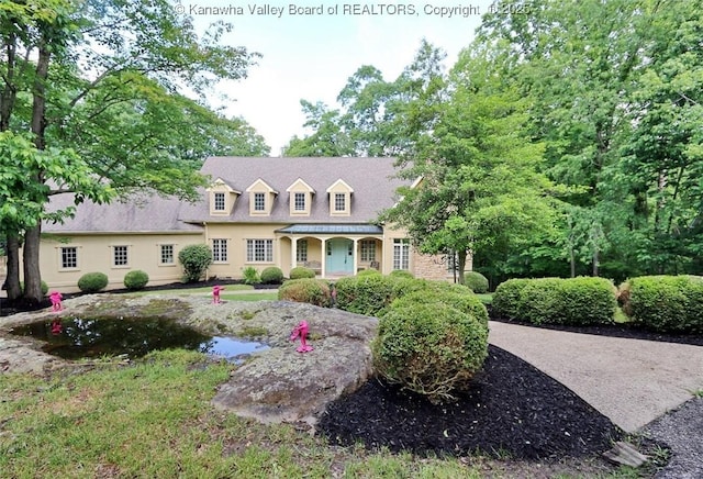 5 Stony Point Rd, Charleston, WV 25314 - new england style home featuring a porch and a garden pond