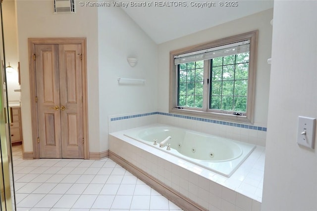 5 Stony Point Rd, Charleston, WV 25314 - full bathroom featuring vaulted ceiling, a jetted tub, and tile patterned flooring