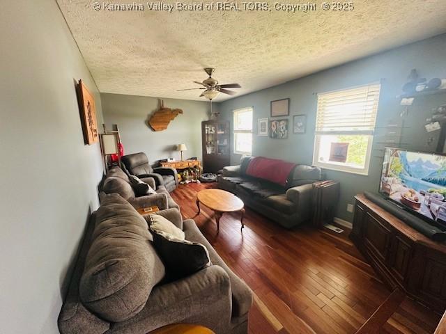 136 Timberlake Cir, Scott Depot, WV 25560 - living room featuring a textured ceiling, ceiling fan, and hardwood / wood-style flooring