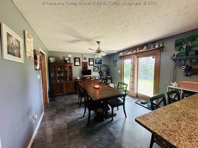 136 Timberlake Cir, Scott Depot, WV 25560 - dining room featuring a textured ceiling, ceiling fan, and baseboards