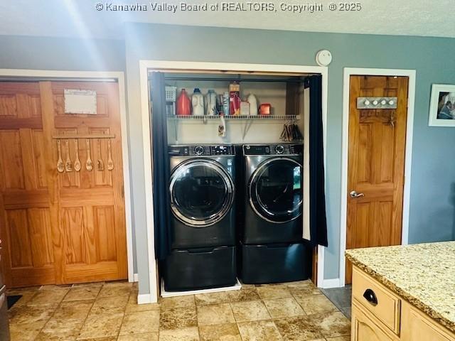 136 Timberlake Cir, Scott Depot, WV 25560 - laundry room with baseboards, washer and clothes dryer, and light stone finish floors