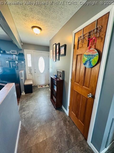 136 Timberlake Cir, Scott Depot, WV 25560 - foyer with baseboards and a textured ceiling