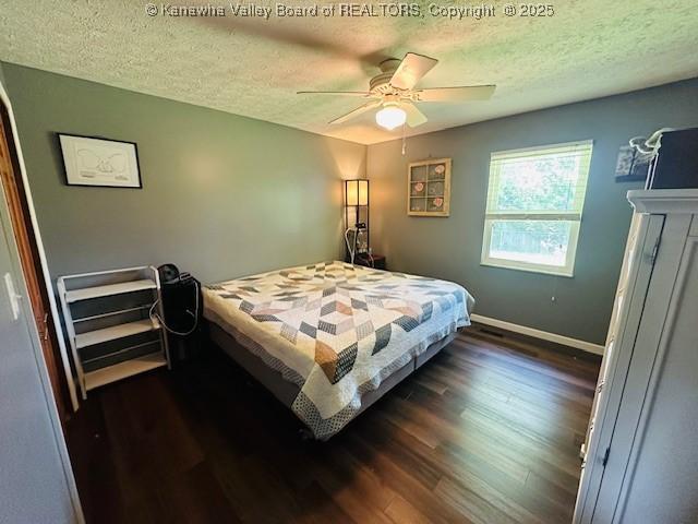 136 Timberlake Cir, Scott Depot, WV 25560 - bedroom featuring a textured ceiling, dark wood-style flooring, baseboards, and a ceiling fan
