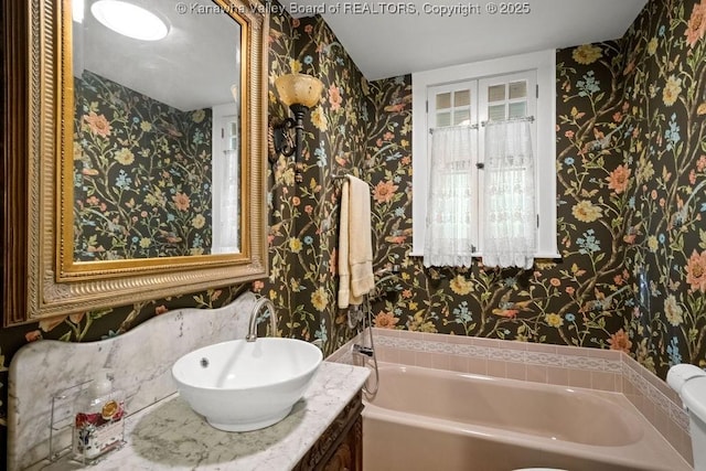 1931 Village Run Rd, White Sulphur Springs, WV 24986 - bathroom featuring wallpapered walls, a bath, and vanity