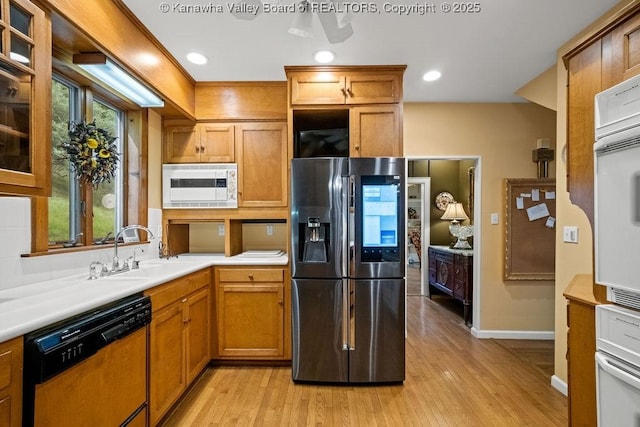 1931 Village Run Rd, White Sulphur Springs, WV 24986 - kitchen featuring white appliances, a sink, light wood finished floors, baseboards, and light countertops
