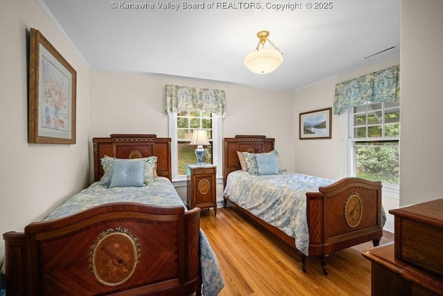 1931 Village Run Rd, White Sulphur Springs, WV 24986 - bedroom with wood finished floors and ornamental molding