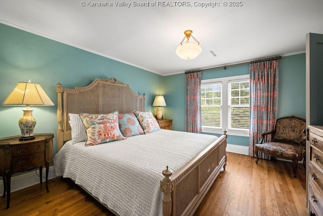 1931 Village Run Rd, White Sulphur Springs, WV 24986 - bedroom featuring wood finished floors, baseboards, and crown molding