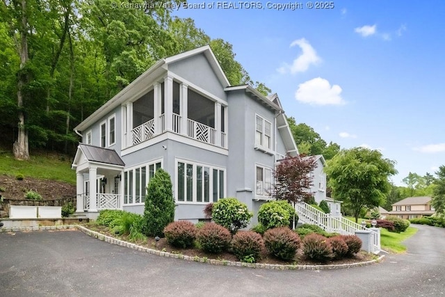 1931 Village Run Rd, White Sulphur Springs, WV 24986 - view of property exterior featuring stucco siding and a balcony