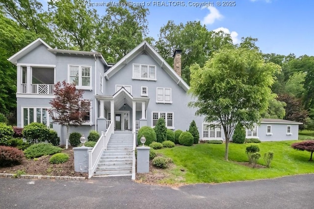 1931 Village Run Rd, White Sulphur Springs, WV 24986 - view of front of property with a chimney, stucco siding, and a front lawn