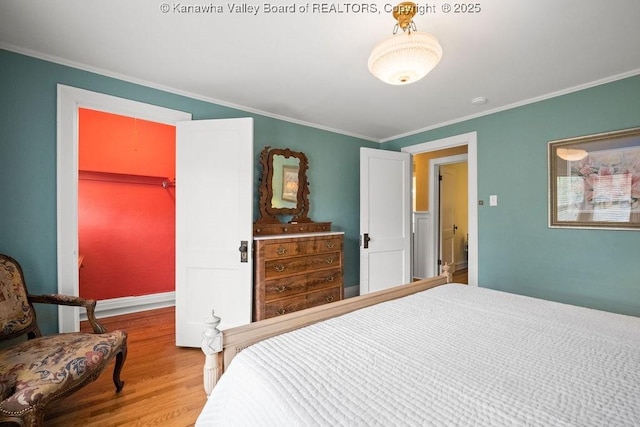 1931 Village Run Rd, White Sulphur Springs, WV 24986 - bedroom featuring wood finished floors, ornamental molding, a spacious closet, a closet, and baseboards