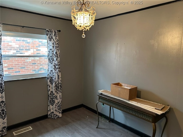 110 3rd Ave, Glasgow, WV 25086 - spare room featuring wood finished floors, a chandelier, crown molding, and baseboards