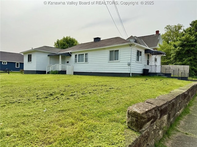 300 Sycamore St, Ravenswood, WV 26164 - rear view of property featuring a chimney