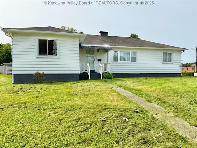 300 Sycamore St, Ravenswood, WV 26164 - rear view of property with a yard and a chimney