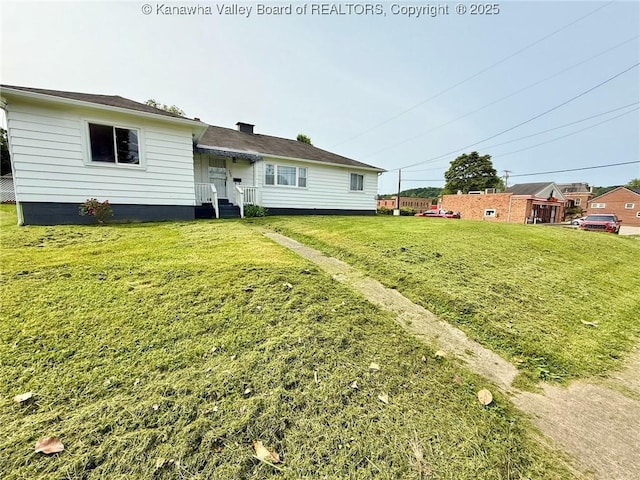 300 Sycamore St, Ravenswood, WV 26164 - rear view of house with a lawn