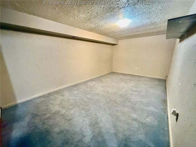 300 Sycamore St, Ravenswood, WV 26164 - finished basement with a textured ceiling and baseboards