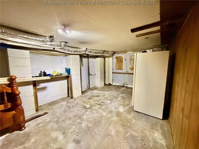 300 Sycamore St, Ravenswood, WV 26164 - unfinished below grade area with freestanding refrigerator