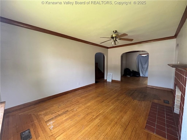 618 Hunt Ave, Charleston, WV 25302 - empty room featuring a ceiling fan, arched walkways, hardwood / wood-style flooring, baseboards, and crown molding