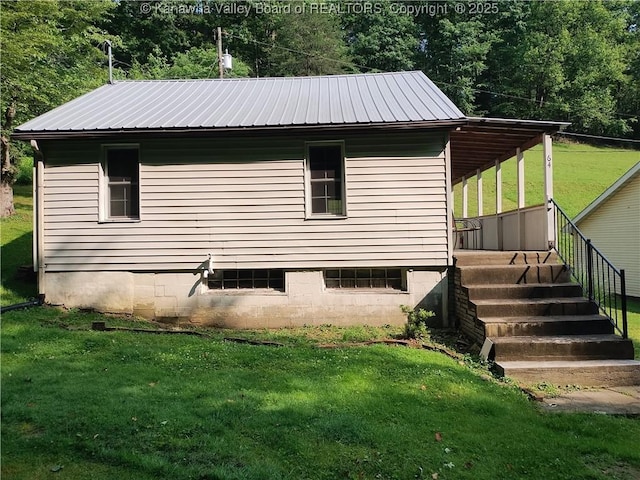 64 Haystack Ln, Charleston, WV 25311 - view of home's exterior with a lawn and metal roof