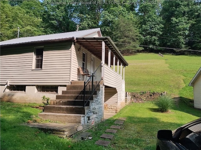 64 Haystack Ln, Charleston, WV 25311 - view of side of home featuring a yard, metal roof, and stairway