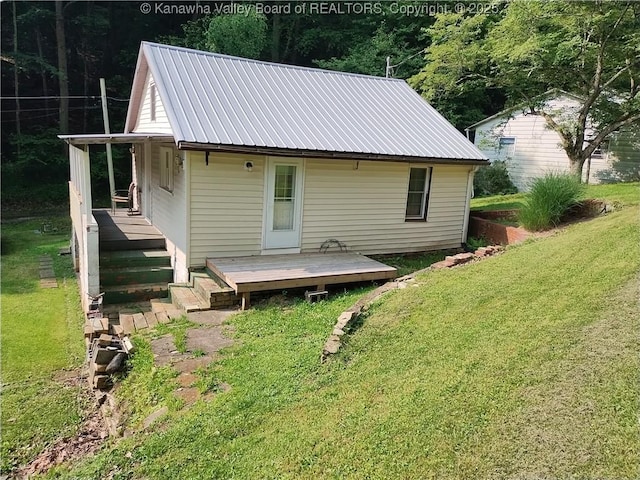 64 Haystack Ln, Charleston, WV 25311 - back of house featuring a lawn, metal roof, and a deck