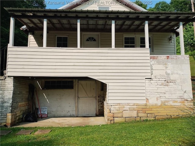 64 Haystack Ln, Charleston, WV 25311 - view of home's exterior with a balcony and stone siding
