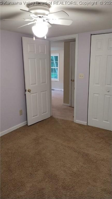 64 Haystack Ln, Charleston, WV 25311 - unfurnished bedroom with light carpet, baseboards, and a ceiling fan