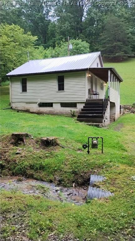 64 Haystack Ln, Charleston, WV 25311 - back of house featuring stairs, a yard, and metal roof