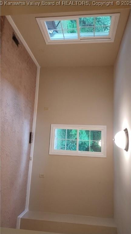64 Haystack Ln, Charleston, WV 25311 - empty room with plenty of natural light and a skylight