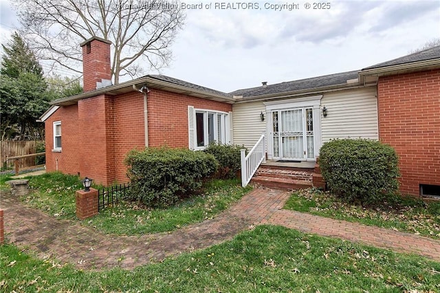 4302 Virginia Ave, Charleston, WV 25304 - view of front of home with brick siding and a chimney