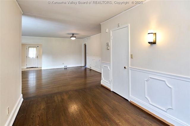4302 Virginia Ave, Charleston, WV 25304 - spare room featuring dark wood-style floors, a wainscoted wall, a decorative wall, and crown molding