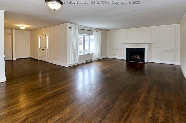 4302 Virginia Ave, Charleston, WV 25304 - unfurnished living room with dark wood-style flooring, a fireplace, and baseboards