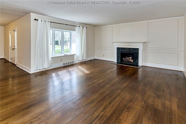 4302 Virginia Ave, Charleston, WV 25304 - unfurnished living room with dark wood finished floors, a high end fireplace, and baseboards