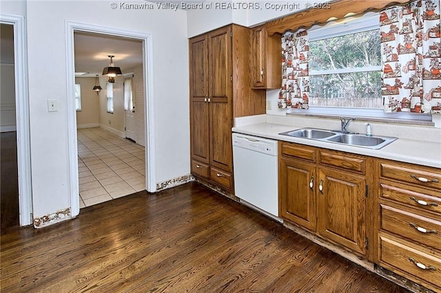 4302 Virginia Ave, Charleston, WV 25304 - kitchen featuring dishwasher, a sink, light countertops, brown cabinets, and dark tile patterned floors