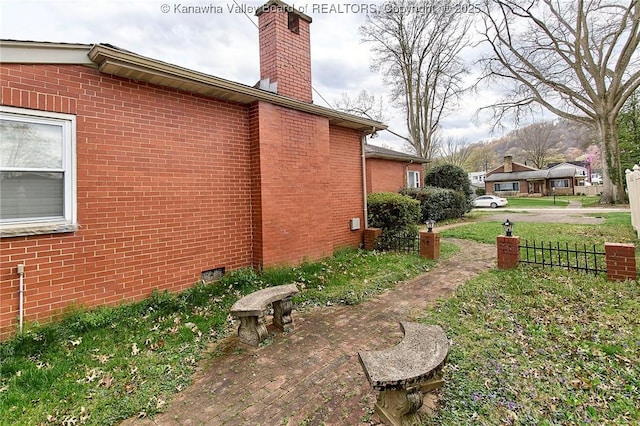 4302 Virginia Ave, Charleston, WV 25304 - view of property exterior with brick siding, a chimney, and crawl space