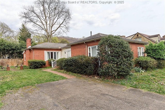 4302 Virginia Ave, Charleston, WV 25304 - view of front of house featuring brick siding and a chimney