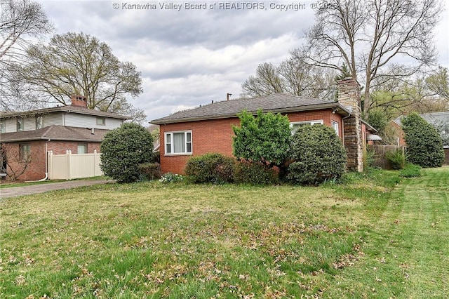 4302 Virginia Ave, Charleston, WV 25304 - view of property exterior featuring brick siding and a chimney
