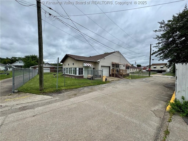 5125 Indiana St, South Charleston, WV 25309 - view of front of property with an attached garage and asphalt driveway