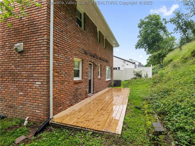 1255 Park Ave, Charleston, WV 25302 - view of side of home featuring a deck, brick siding, and central AC unit