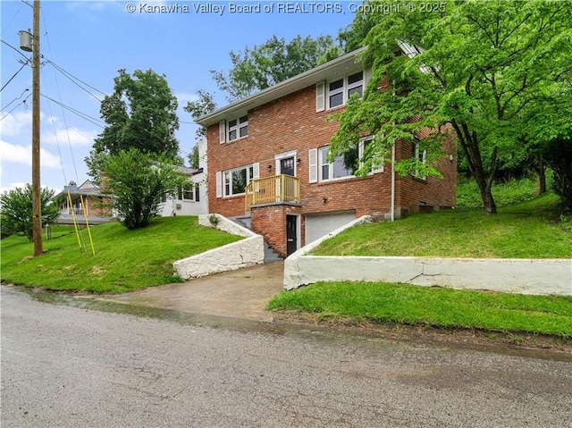 1255 Park Ave, Charleston, WV 25302 - view of front facade with a garage, brick siding, a front yard, and driveway