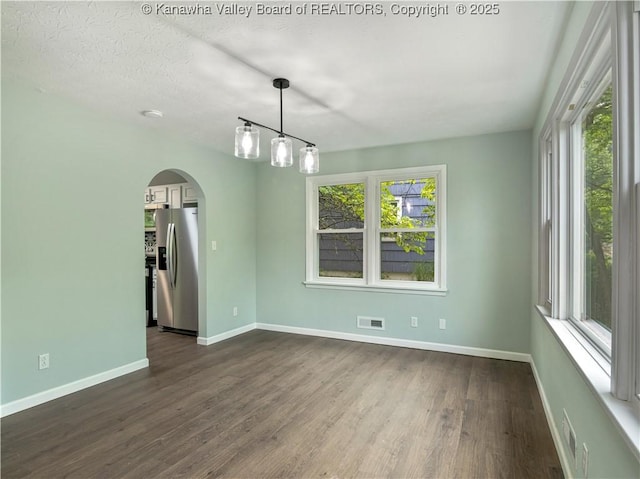 1255 Park Ave, Charleston, WV 25302 - unfurnished room with arched walkways, baseboards, and dark wood finished floors