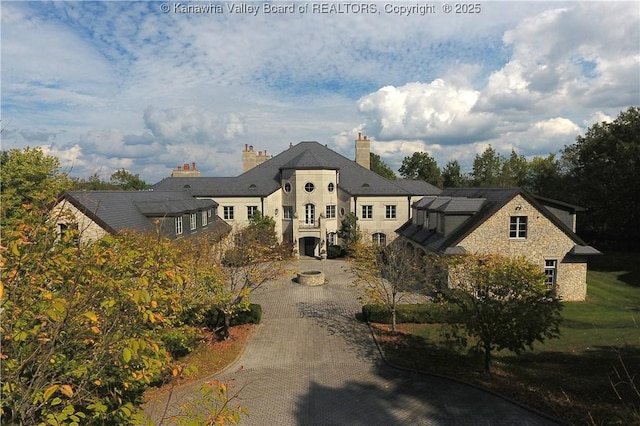 230 Quarry Rdg E, Charleston, WV 25304 - french country inspired facade with solar panels, a chimney, and stone siding