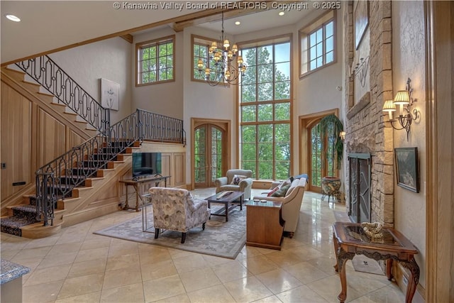 230 Quarry Rdg E, Charleston, WV 25304 - tiled living room featuring a chandelier, stairway, plenty of natural light, a high ceiling, and recessed lighting