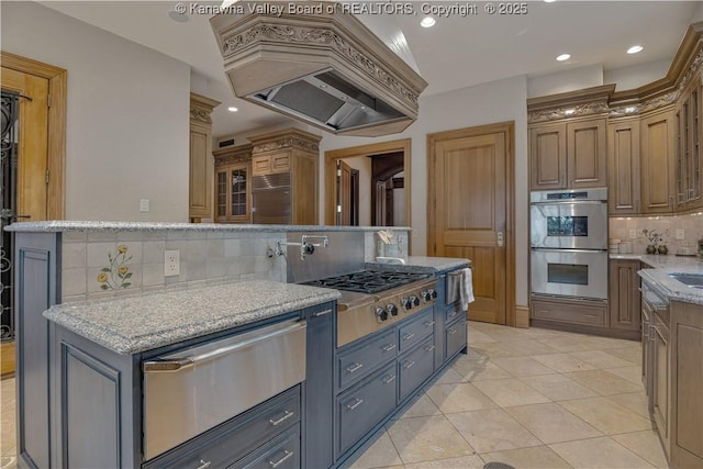230 Quarry Rdg E, Charleston, WV 25304 - kitchen featuring a warming drawer, appliances with stainless steel finishes, custom exhaust hood, tasteful backsplash, and light tile patterned floors